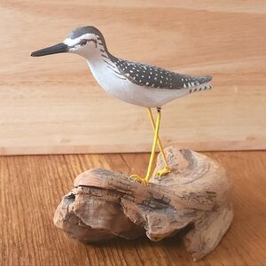 Elegant Gray and White Bird Figurine on Driftwood